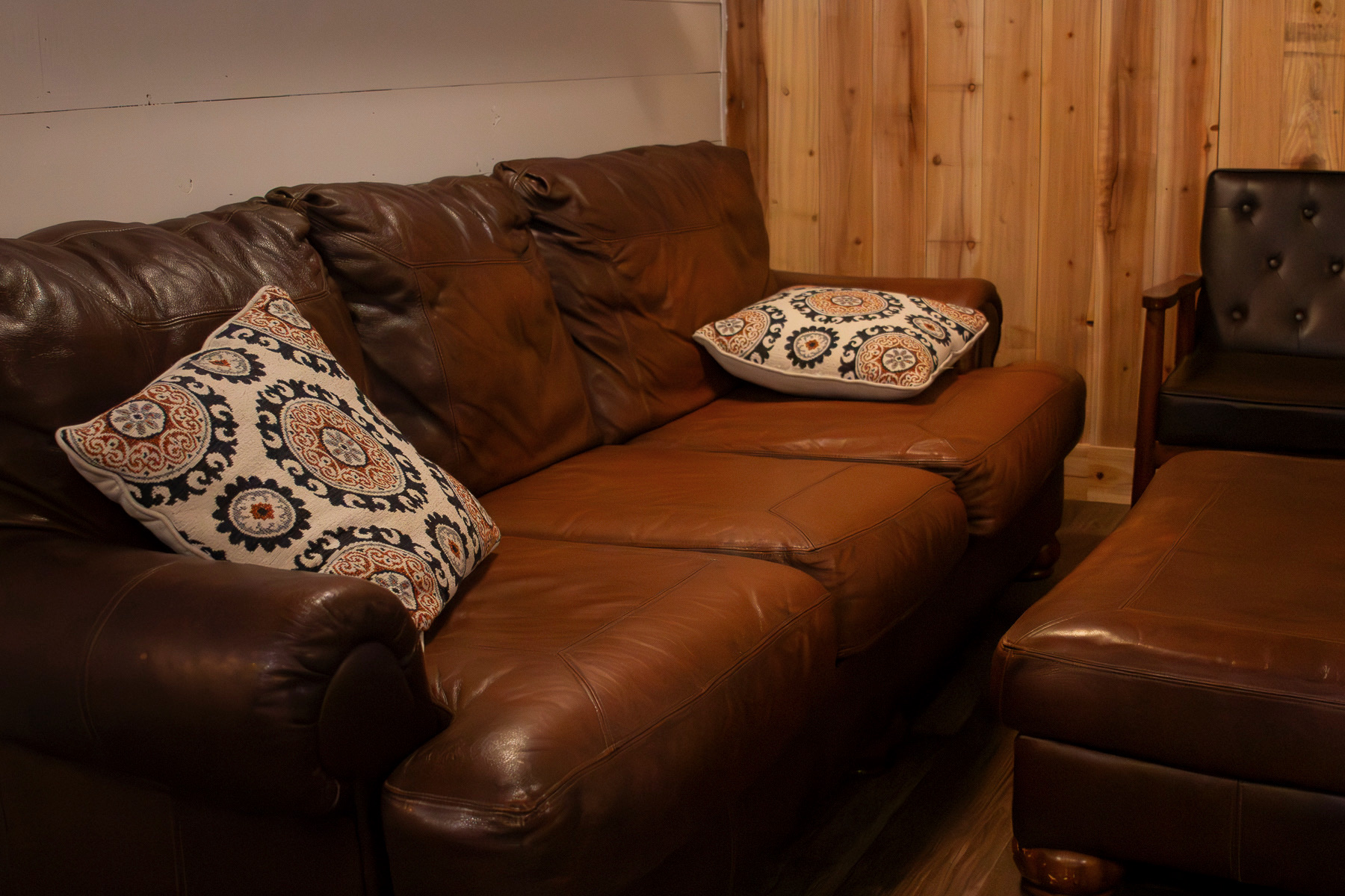 Leather couches in the lounge at Benco Provisions